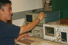 male student working on oscillescopes
